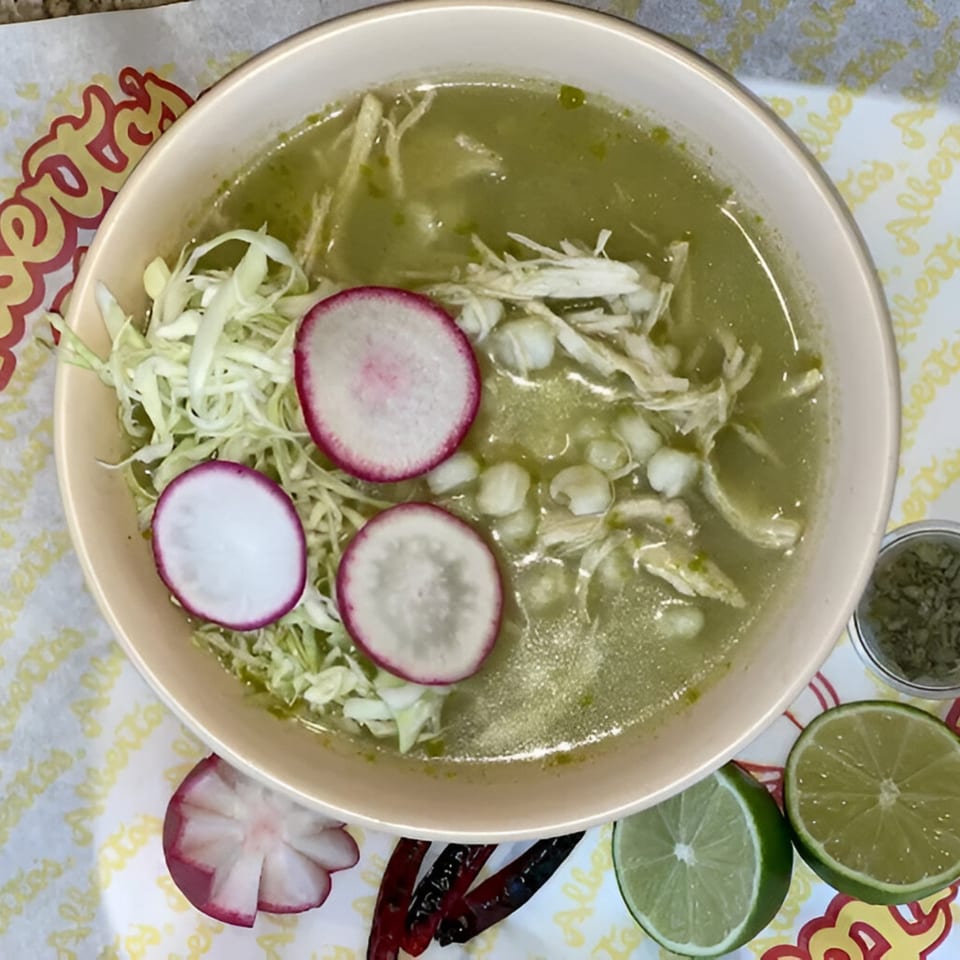 Alberto's of Ontario's green pozole with shredded chicken, hominy, cabbage, radishes, and lime.