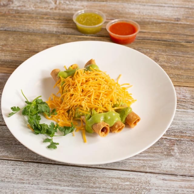 3 Rolled Tacos with Guacamole.